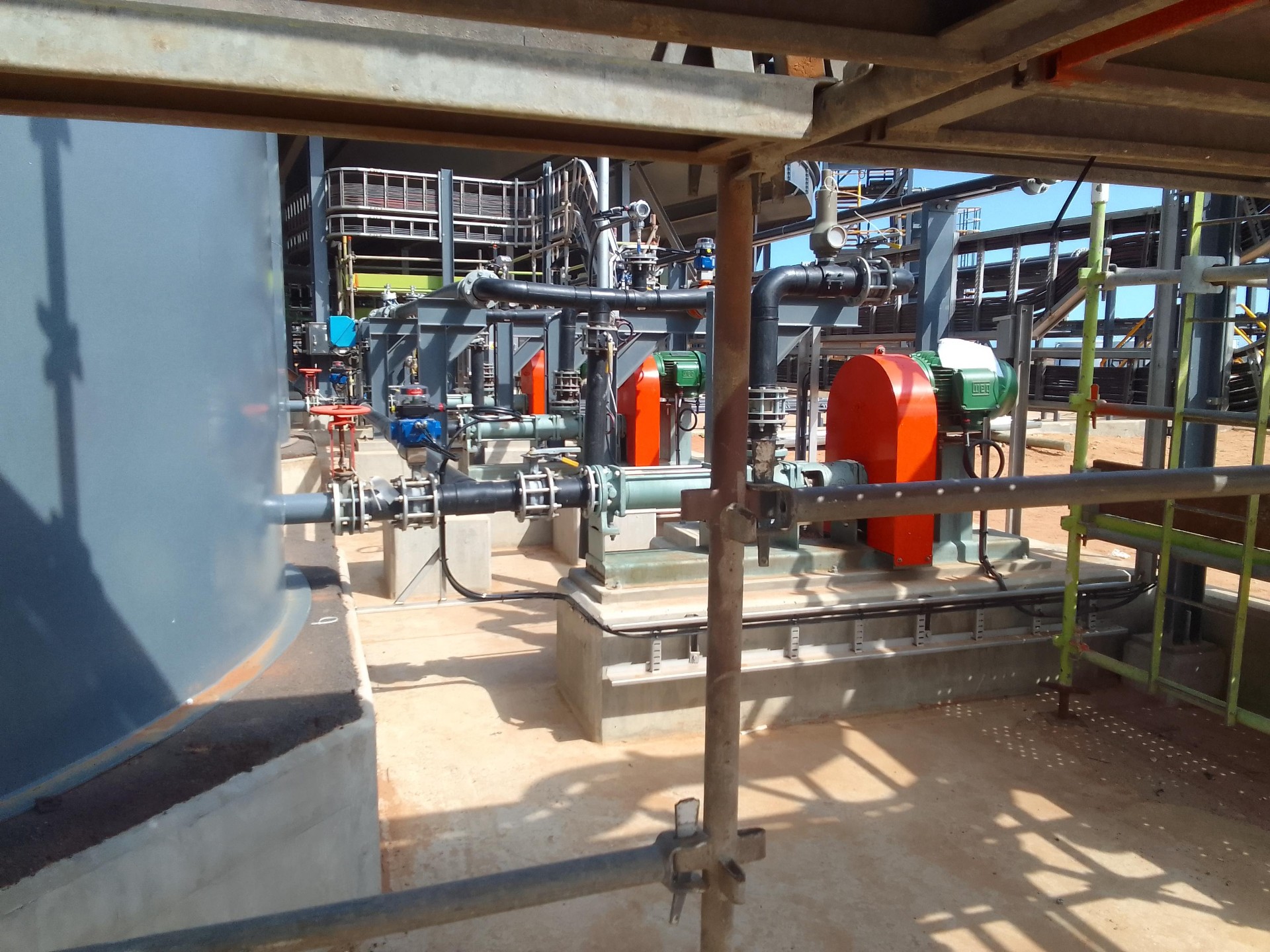 Tronox piping installation with pumps and valves at a processing plant