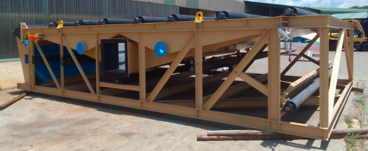Structural linear screen frame with rollers and steelwork in a fabrication yard